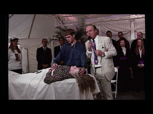 The real cancer is the pastor's suit.